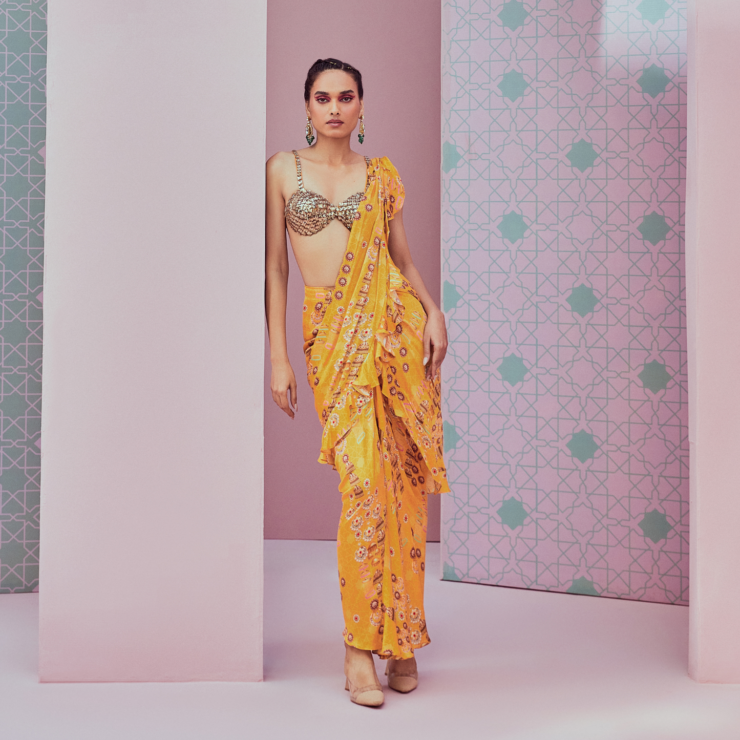 Crystal blouse paired with yellow pre stitched saree